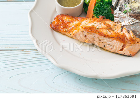 grilled salmon steak with bake potato grilled salmon steak with bake potato 117862691