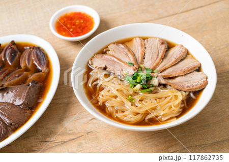 duck noodles with stewed duck soup 117862735