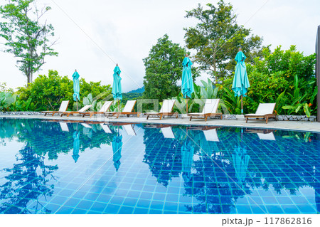 pool bed around swimming pool with mountain hill background pool bed around swimming pool with mountain hill background 117862816