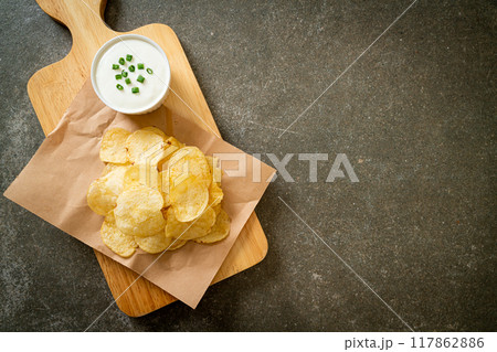 potato chips with sour cream potato chips with sour cream 117862886