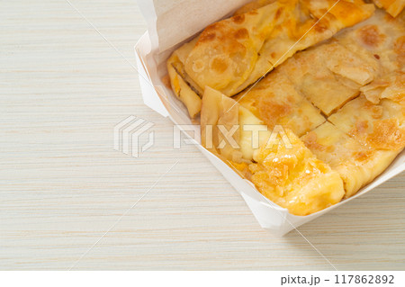 roti with egg and sweetened condensed milk roti with egg and sweetened condensed milk 117862892