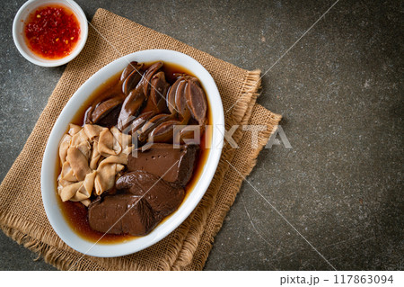 stewed duck offal in brown soup 117863094