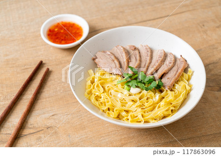 dried duck noodles in white bowl 117863096