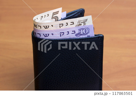 Israeli pound in the black wallet Israeli pound in the black wallet 117863501