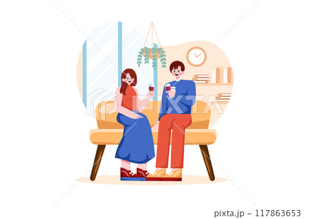 Young couple sitting at armchairs in the room holding wineglasses Young couple sitting at armchairs in the room holding wineglasses 117863653