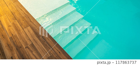 Swimming pool entrance steps with clean blue water at modern villa Swimming pool entrance steps with clean blue water at modern villa 117863737