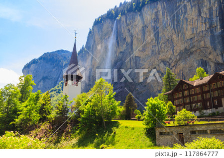 Lauterbrunnen village with famous church and Staubbach waterfall, Bernese Oberland, Switzerland Lauterbrunnen village with famous church and Staubbach waterfall, Bernese Oberland, Switzerland 117864777