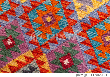 Woolen carpet with traditional colorful ethnic geometric ornament. Close up 117865121