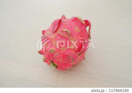 Dragon fruit on wooden table. Top view. Healthy food concept. Dragon fruit on wooden table. Top view. Healthy food concept. 117866180