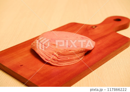 Slices of ham on a cutting board, closeup of photo Slices of ham on a cutting board, closeup of photo 117866222