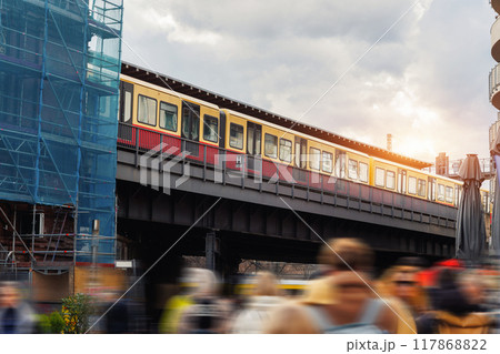 Scenic evening view  S-bahn subway train bridge in Berlin Mitte central district on Hackescher Markt at dusk sunset. Urban european transport commute cityscape Germany scene background 117868822