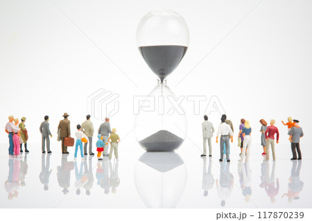 miniature people. people of different ages and statuses stand in line near the hourglass 117870239