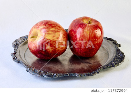 Two ripe apples on a white background 117872994