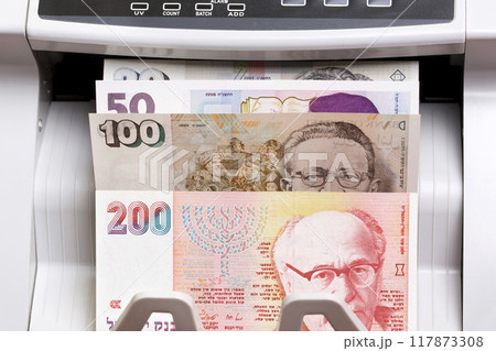 Israeli new shekel in the counting machine Israeli new shekel in the counting machine 117873308