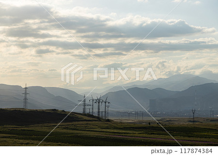 Armenian Power Plant Silhouetted Against a Hazy Mountain Range 117874384