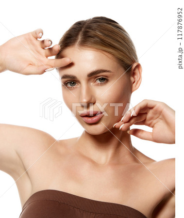 Portrait of attractive young woman with smooth skin, demonstrating perfect complexion and natural beauty. Advanced skin care and cosmetic routines. 117876952