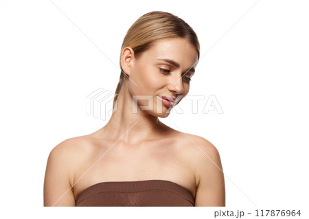 Essence of effective skincare and pursuit of aesthetic perfection. Portrait of beautiful young woman demonstrating perfect face Essence of effective skincare and pursuit of aesthetic perfection. Portrait of beautiful young woman demonstrating perfect face 117876964