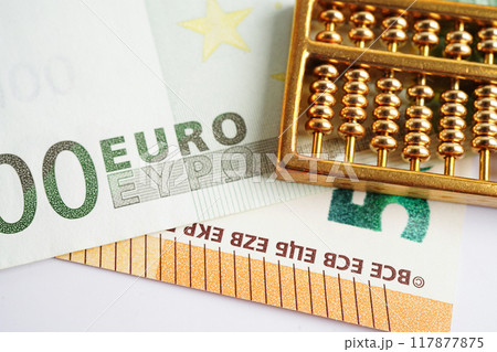 Gold abacus on banknote money, finance trading investment business currency concept. 117877875