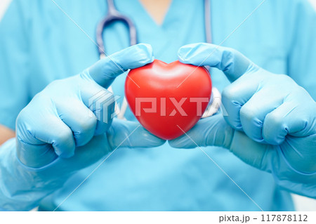 Asian woman doctor holding red heart for health in hospital. Asian woman doctor holding red heart for health in hospital. 117878112