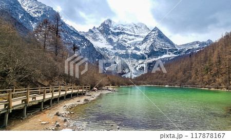 Scenic pearl lake with green color water with mount Xiannairi as backdrop at Yading Nature Reserve, Sichuan 117878167