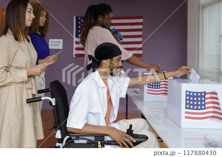 People Putting Bulletins In Boxes People Putting Bulletins In Boxes 117880430