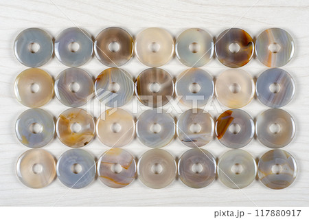 Mindful Minerology: The Fascinating World of Blue Lace Agate Revealed Through Symmetrical Donut Stones. 117880917