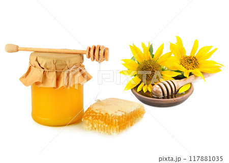Honey pot, honeycomb and wooden drizzler isolated on white . Collage. Honey pot, honeycomb and wooden drizzler isolated on white . Collage. 117881035