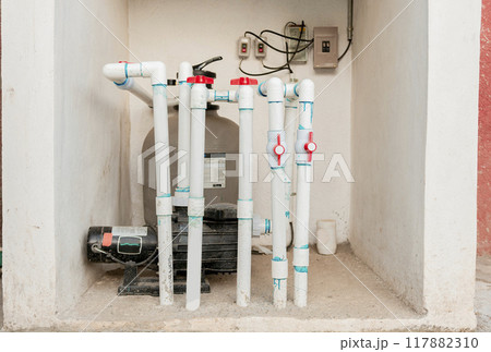 Pool pump with sand filter installed. Pool purification and maintenance system. Home pool filter and treatment plant installed 117882310