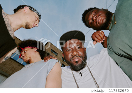Low angle shot of best friends posing for photo while partying together in their neighborhood 117882670