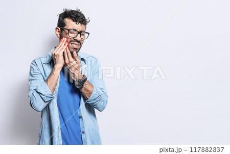 A man suffering from toothache isolated, People with toothache, person with hand on cheek with toothache. Concept of people with periodontitis 117882837