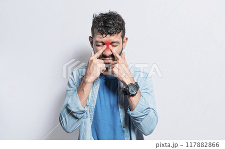 People with pain touching nose. Handsome man with nasal bridge pain, Man with nasal bridge headache. Sinus pain concept People with pain touching nose. Handsome man with nasal bridge pain, Man with nasal bridge headache. Sinus pain concept 117882866