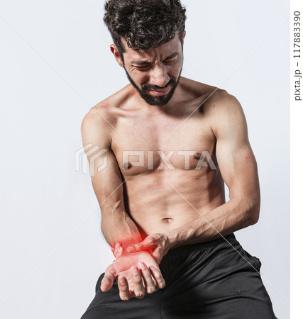 Person with wrist pain isolated, concept of man with pain in the hands, man with arthritis rubbing, person with pain in the wrist, Concept of arthritis in the wrist 117883390