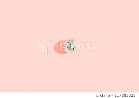 Christmas wallpaper with shiny disco balls on pink in minimal style. Retro party time concept 117883629