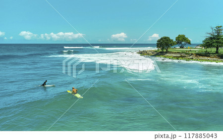 Aerial view the Group of surfers chilling out on the beach. Los Caracas beach, La Guaira - Venezuela. 117885043