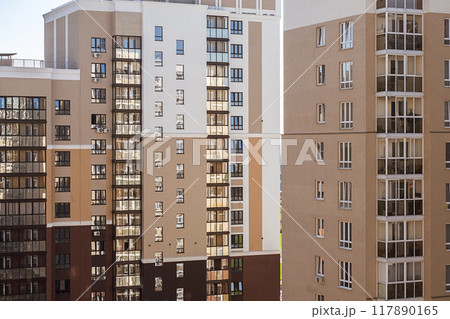 Modern apartment buildings with multiple windows and balconies. Modern apartment buildings with multiple windows and balconies. 117890165