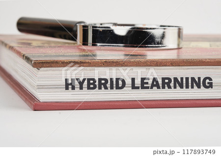 Business, educational and hybrid learning concept, copy space. Concept words HYBRID LEARNING on the end of the book in close-up 117893749