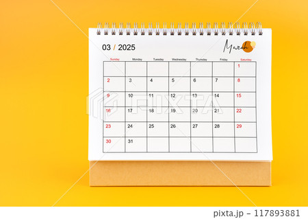 March 2025, Monthly desk calendar for 2025 year on yellow background. 117893881