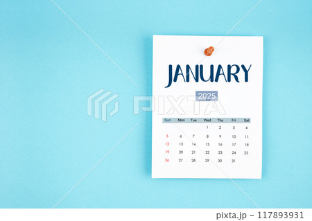 January 2025 calendar page with push pin on blue background. January 2025 calendar page with push pin on blue background. 117893931
