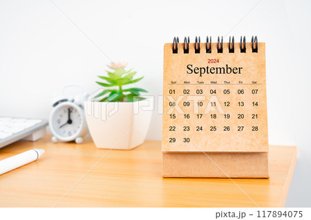 September 2024 desk calendar on worktable. September 2024 desk calendar on worktable. 117894075