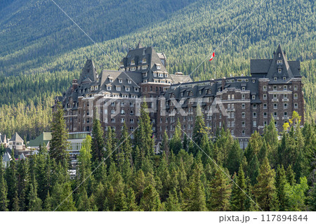Banff, Alberta, Canada - AUG 28 2020 : Fairmont Banff Springs in summer sunny day. View from Surprise Corner Viewpoint. Banff National Park, Canadian Rockies. Banff, Alberta, Canada - AUG 28 2020 : Fairmont Banff Springs in summer sunny day. View from Surprise Corner Viewpoint. Banff National Park, Canadian Rockies. 117894844