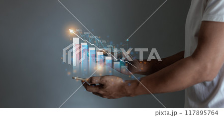 Young man hand using smartphone to visualize money growth The phone screen displays graphs  117895764