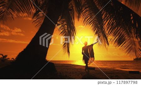 Woman is dancing on a beach at sunset, enjoying the beauty and peace of nature. The image evokes feelings of freedom, joy, and serenity Woman is dancing on a beach at sunset, enjoying the beauty and peace of nature. The image evokes feelings of freedom, joy, and serenity 117897798