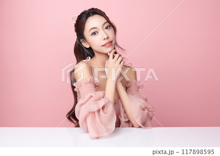Beautiful young asian woman with clean fresh skin on pink background, Face care, Facial treatment, Cosmetology, beauty and spa, Asian women portrait. Beautiful young asian woman with clean fresh skin on pink background, Face care, Facial treatment, Cosmetology, beauty and spa, Asian women portrait. 117898595