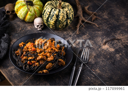 Halloween dish black pasta with bolognese 117899961