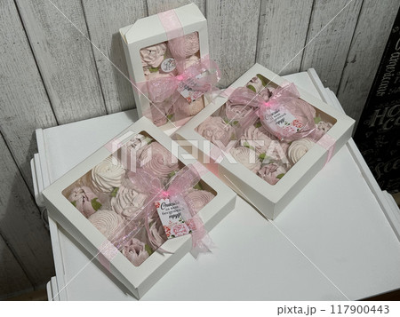 A box of homemade marshmallows. Tied with a ribbon. The tags have the inscription in Russian A box of homemade marshmallows. Tied with a ribbon. The tags have the inscription in Russian 117900443
