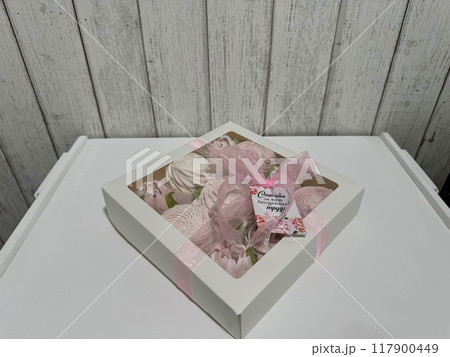 A box of homemade marshmallows. Tied with a ribbon. The tag has the inscription in Russian A box of homemade marshmallows. Tied with a ribbon. The tag has the inscription in Russian 117900449