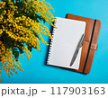 ミモザの花が飾られた青いテーブル 117903163