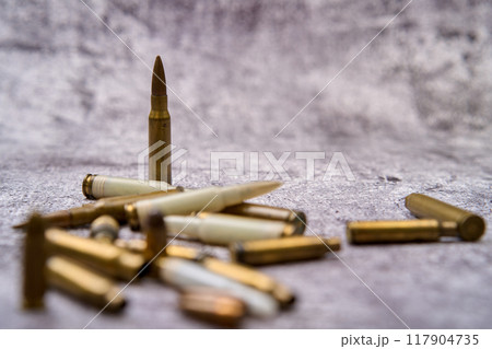 Composition of rounds of ammunition on floor 117904735