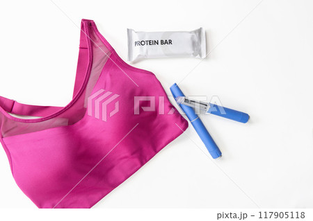 Concept of losing weight with the diabetes drug Ozempic. Sports top, protein bar and Ozempic Concept of losing weight with the diabetes drug Ozempic. Sports top, protein bar and Ozempic 117905118