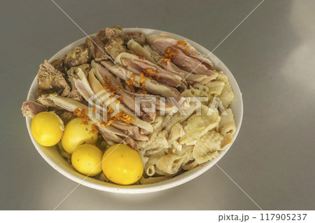 A bowl of Mie Ayam with various toppings. A bowl of Mie Ayam with various toppings. 117905237